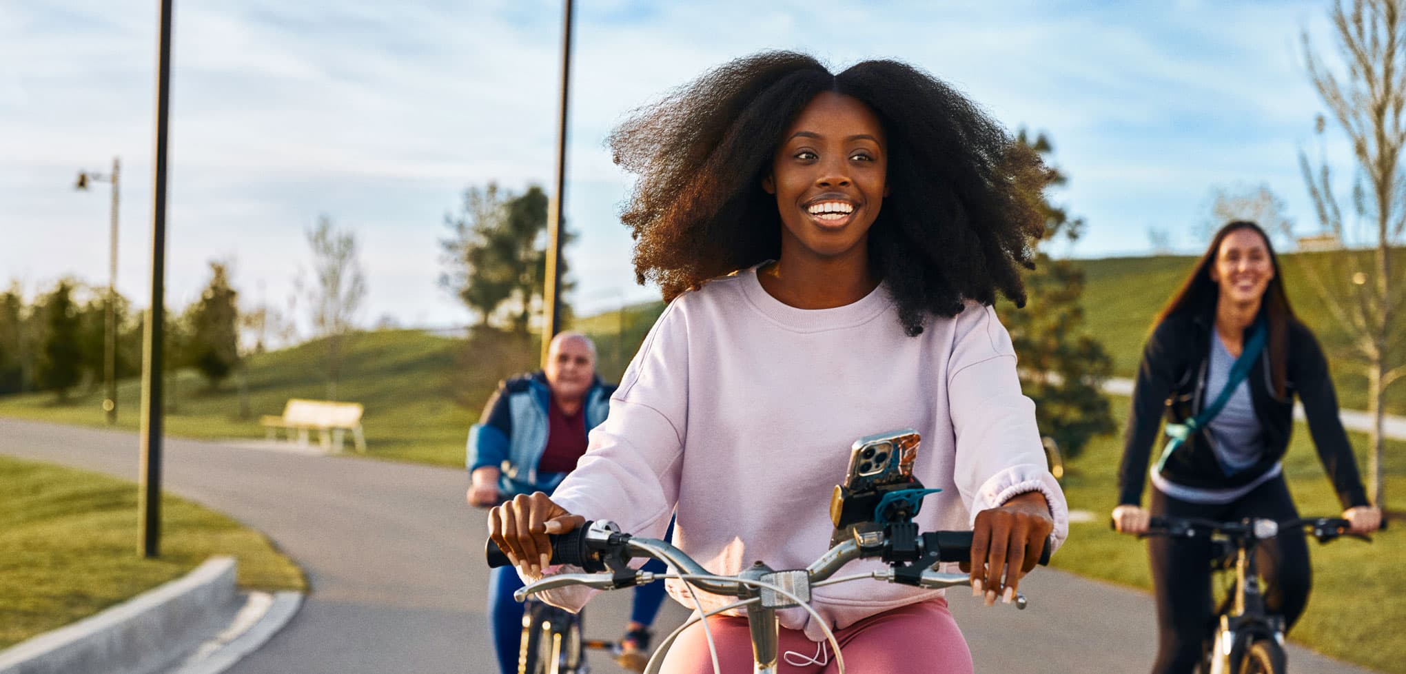 Group of friends riding bikes in a park